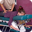 A woman's lower back being adjusted during her chiropractic first visit.