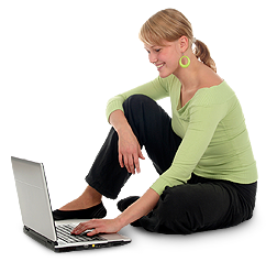 A woman sitting by her computer looking up chiropractic resources.